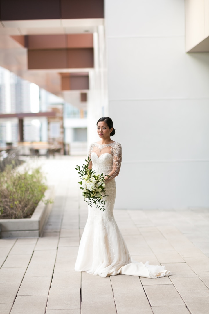 Asian Bride in white wedding gown outside